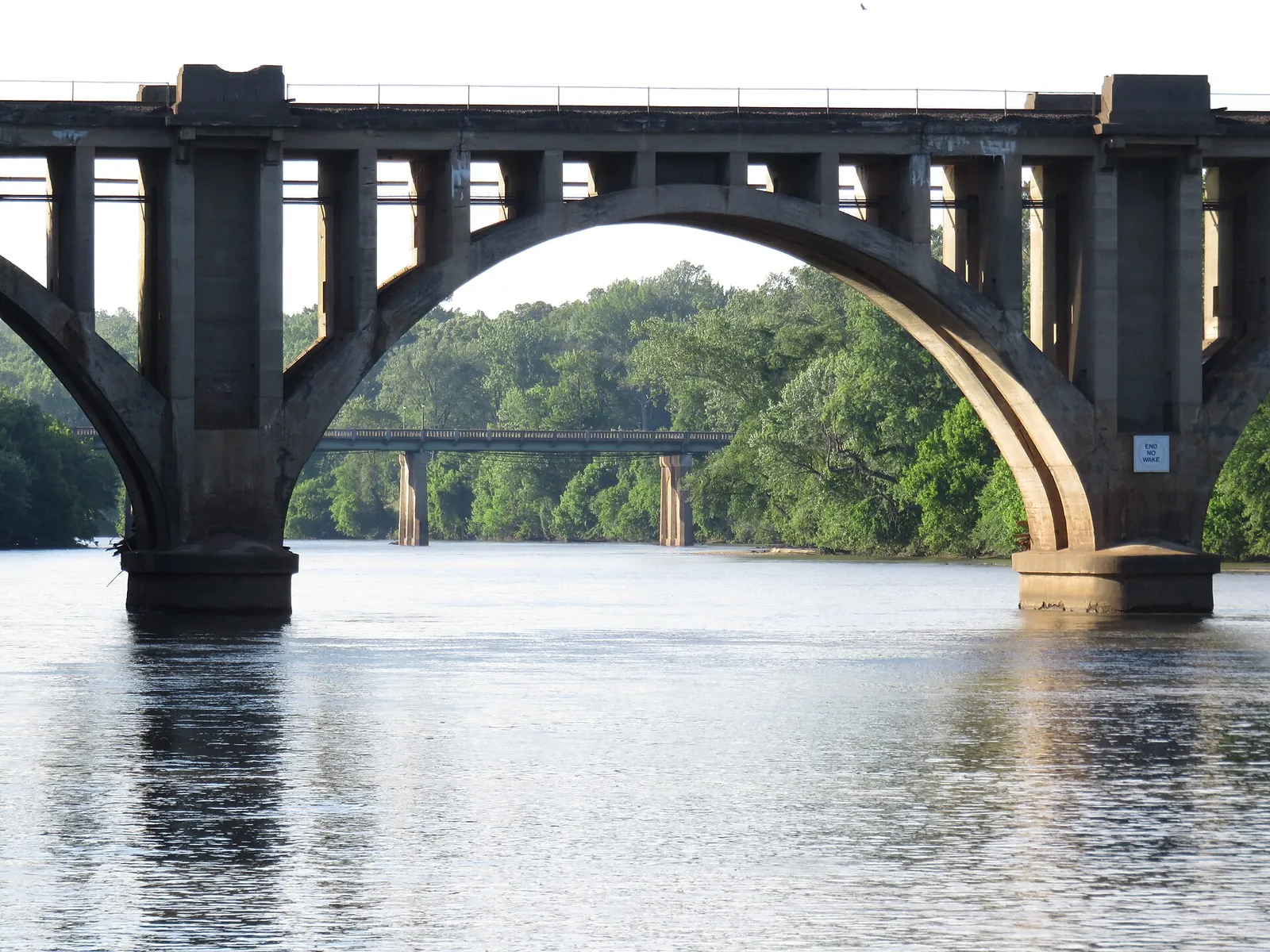 The Rappahannock River seen through an arch of the rail bridge, with the Chatham Bridge beyond.